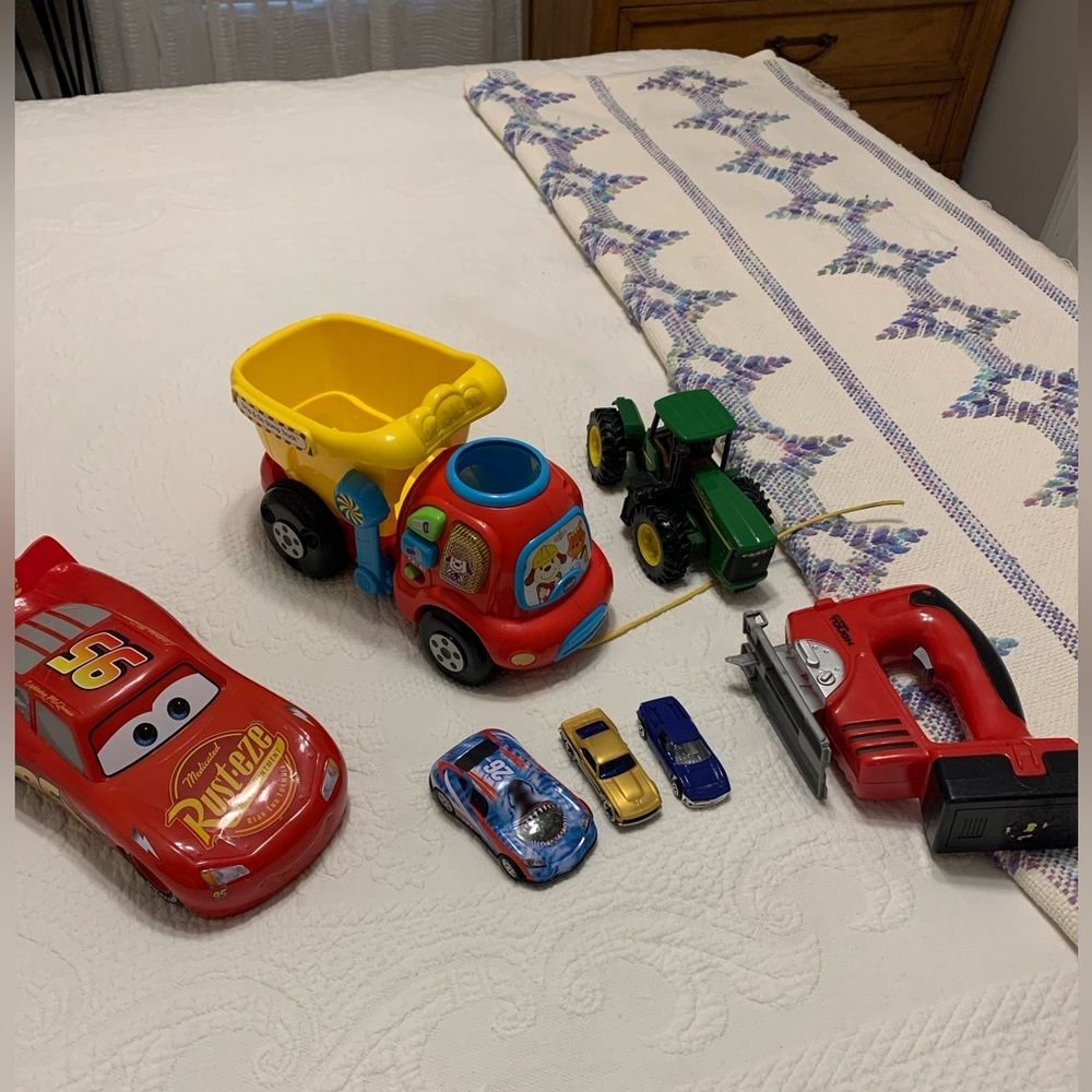Lot of 7 toys.  Dump truck lights up and talks